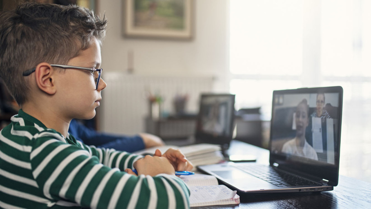 Boy taking an online class